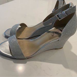Woman silver wedge with straps around the ankle 9.5 new. Perfect for a wedding.